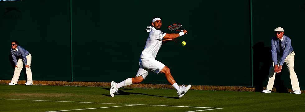 Marcos Wins Wimbledon Opener