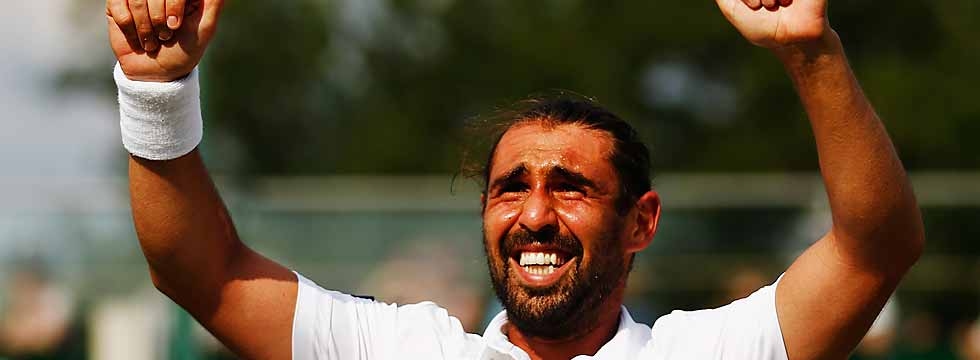 Marcos Wins Wimbledon Thriller
